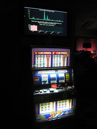 "The completed slot machine at night."